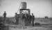 1911p_will_and_others_by_water_tank_on_farm_C1911