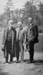 1911t3_unk_old_man_3_men_by_lake_c1911